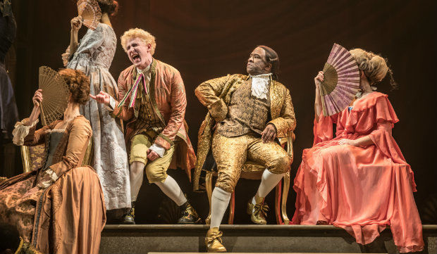 Adam Gillen as Wolfgang Mozart and Lucian Msamati as Antonio Salieri in Amadeus at the National Theatre. Photo by Marc Brenner