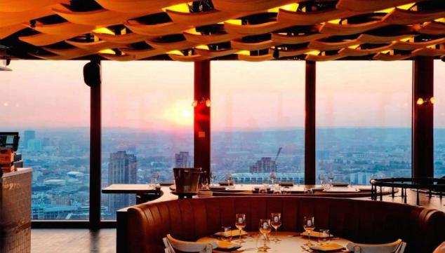 The Duck and Waffle overlooks the bright lights of the city