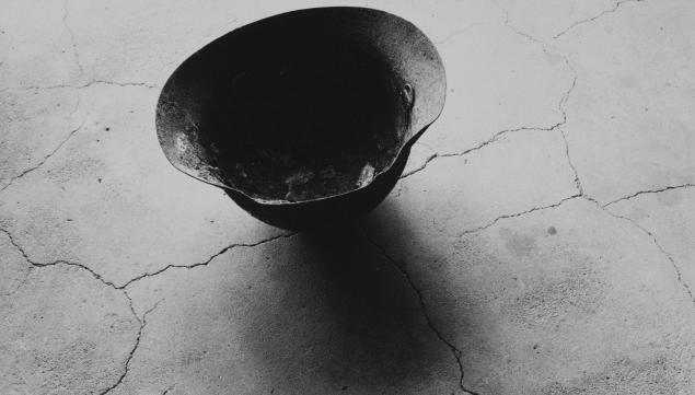 Shomei Tomatsu Steel Helmet with Skull Bone Fused by Atomic Bomb, Nagasaki 1963 © Shomei Tomatsu - interface. Courtesy of Taka Ishii Gallery, Tokyo