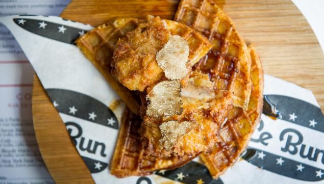 Confit Southern-fried chicken, shaved winter truffles, house waffles, truffle butter and rosemary maple syrup