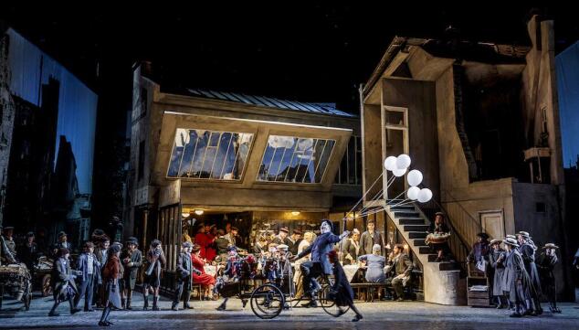 Parisian street life in La Bohème at ENO. Photo: Lloyd Winters