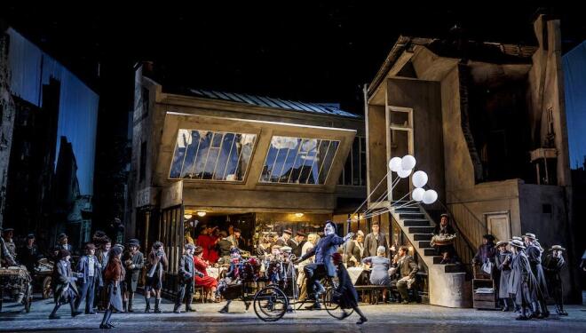 Parisian street life in La Bohème at ENO. Photo: Lloyd Winters