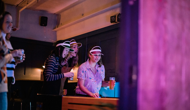 Play shuffleboard at Crazy Eight